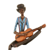 Guitar Player Figurine Sitting