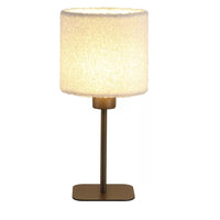 Contemporary bronze bedside table lamp featuring a textured white bouclé lampshade