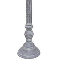 Close-up of distressed grey turned candlestick table lamp base