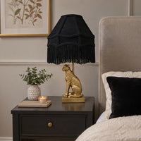 Black leopard table lamp with gold animal base and fringed shade