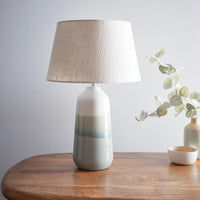 Modern ceramic table lamp with green ombre base and linen drum shade