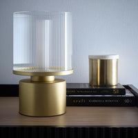 Contemporary gold table lamp with clear glass shade