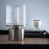Contemporary satin nickel table lamp with clear glass shade